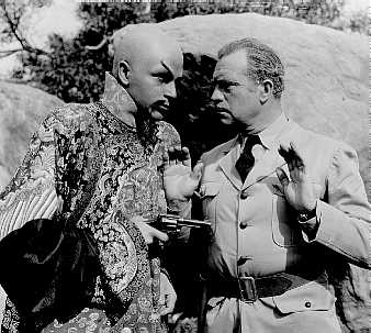 Nayland Smith (William Royle) on the wrong end of the gun